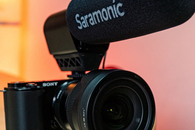 Mirrorless camera with an on-camera microphone on a tripod