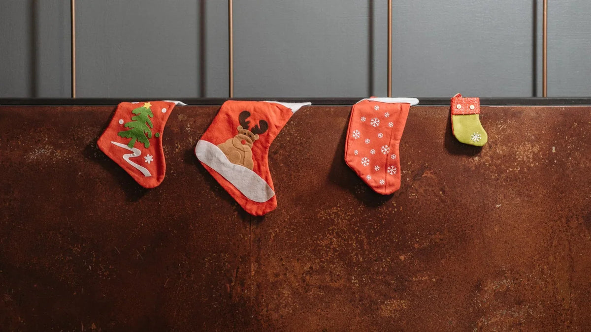 Christmas stockings hanging on a wall – photography stocking stuffers under $25