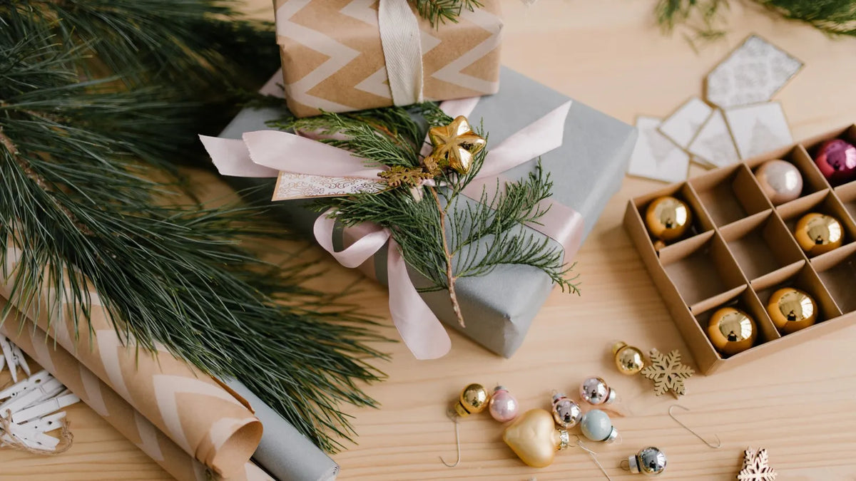 Wrapped Christmas gifts on a table – gifts for photographers 2026 by budget