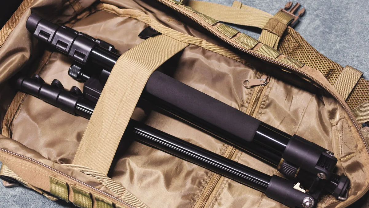 Folded travel tripod packed inside an open camera backpack – Peak Design Travel Tripod vs Ulanzi Zero Y packability